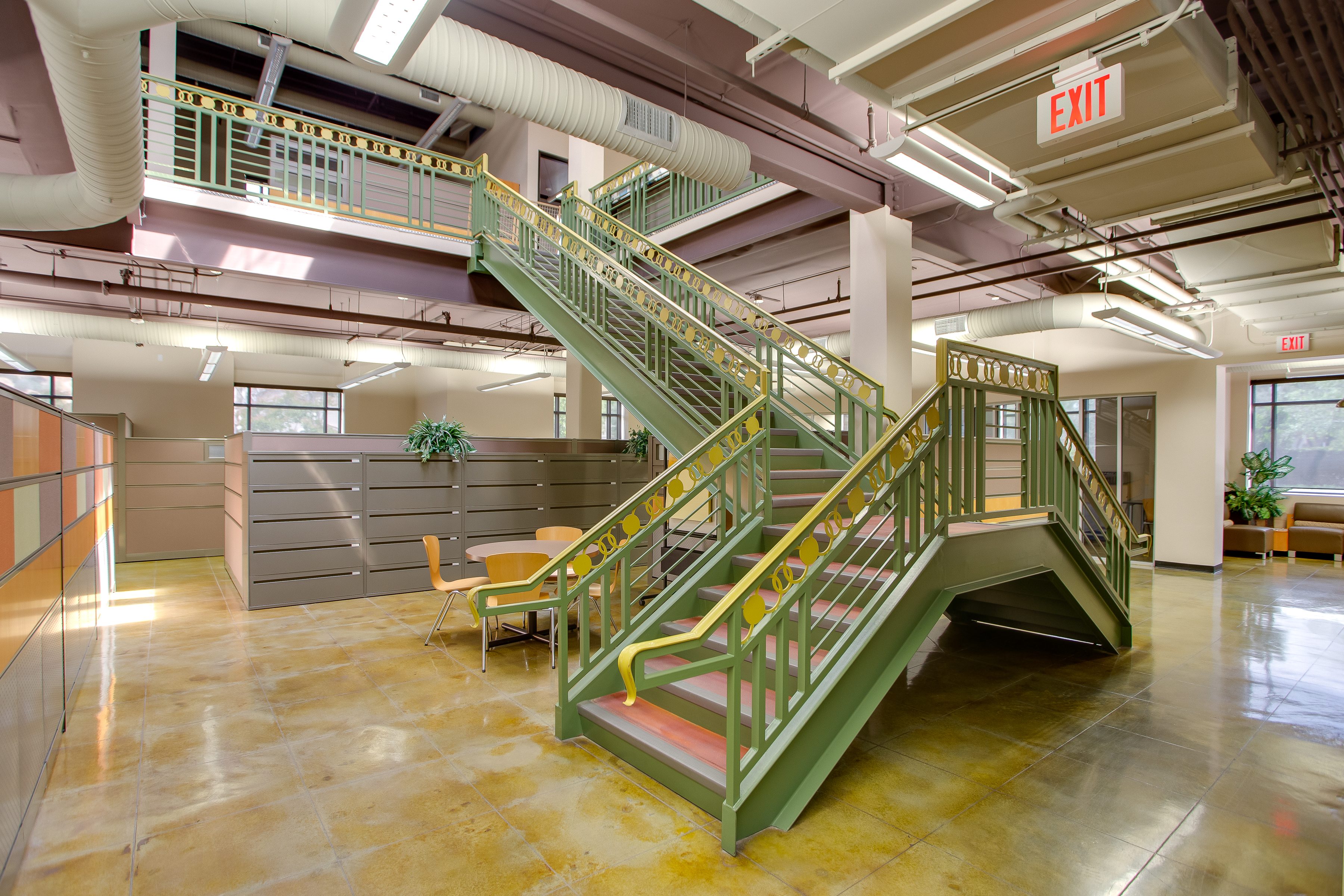 Interior of the Piper Spirit Center showing the green steel staircase between floors.